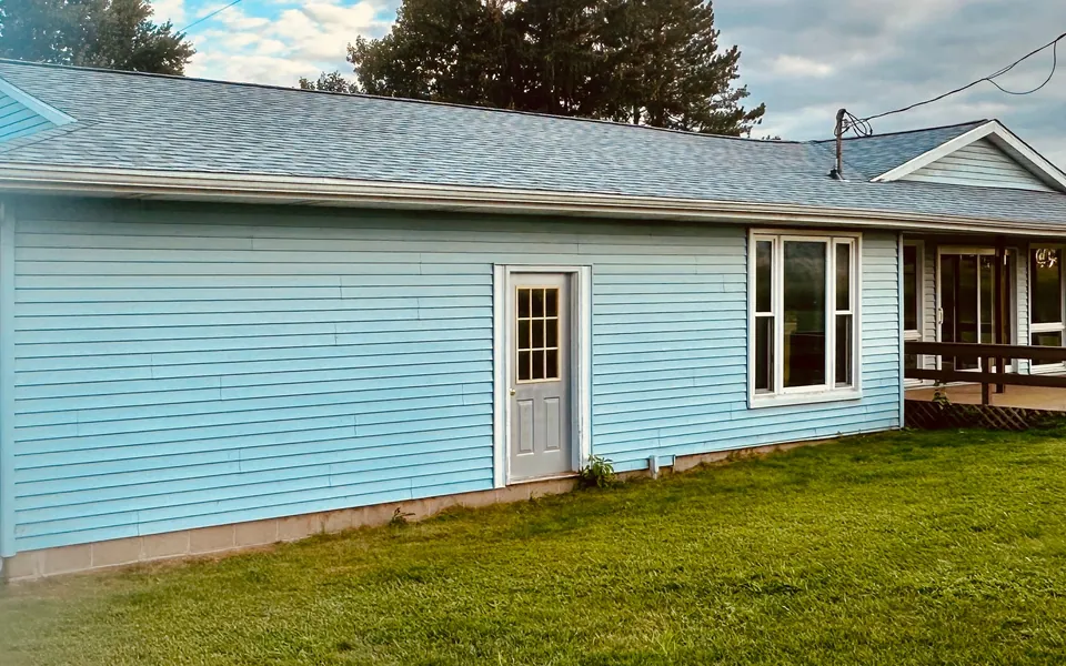Roofline and blue siding on a single-story home